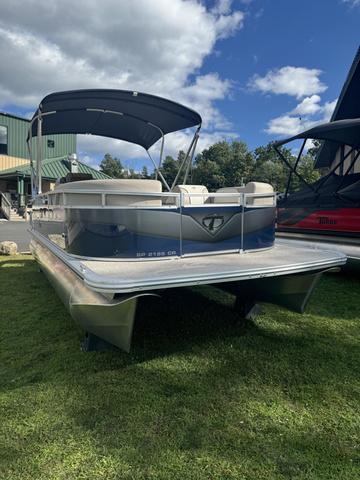 Tahoe Sport 85 2024 Tahoe 21 FT Cruise pontoon boat on grass under blue sky.