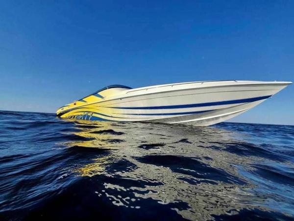 Velocity 322SC 2024 Velocity 322SC speedboat on open water under clear blue sky.