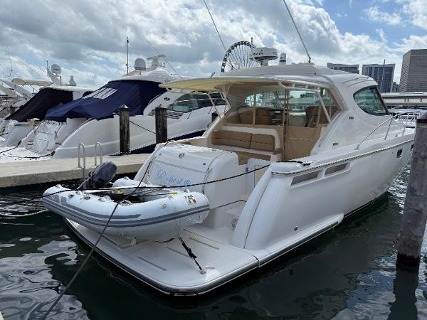 Tiara Yachts 4500 Sovran 2014 Tiara Yachts 4500 Sovran docked with inflatable boat, city skyline in background.