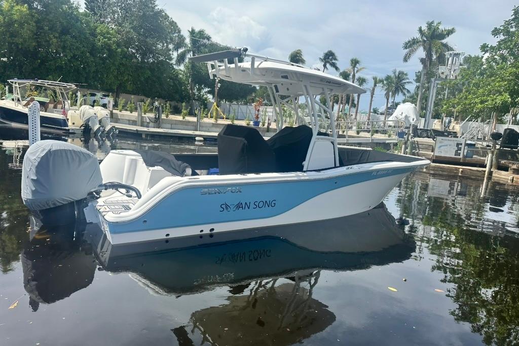 Sea Fox 248 Commander 2022 Sea Fox 248 Commander boat docked in a serene marina setting.