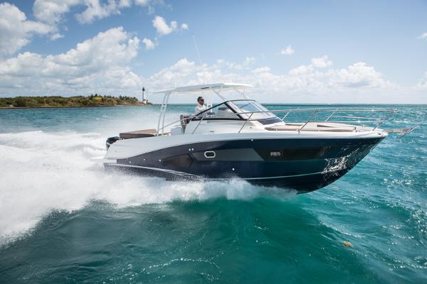 Jeanneau Leader 10.5 WA S2 2026 Jeanneau Leader 10.5 S2 cruising on turquoise waters under a clear sky.