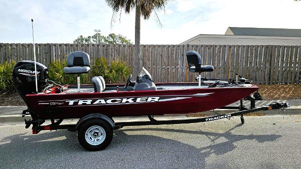 Tracker Pro 170 2025 Tracker Pro 170 boat with Mercury engine, parked on trailer, side view.