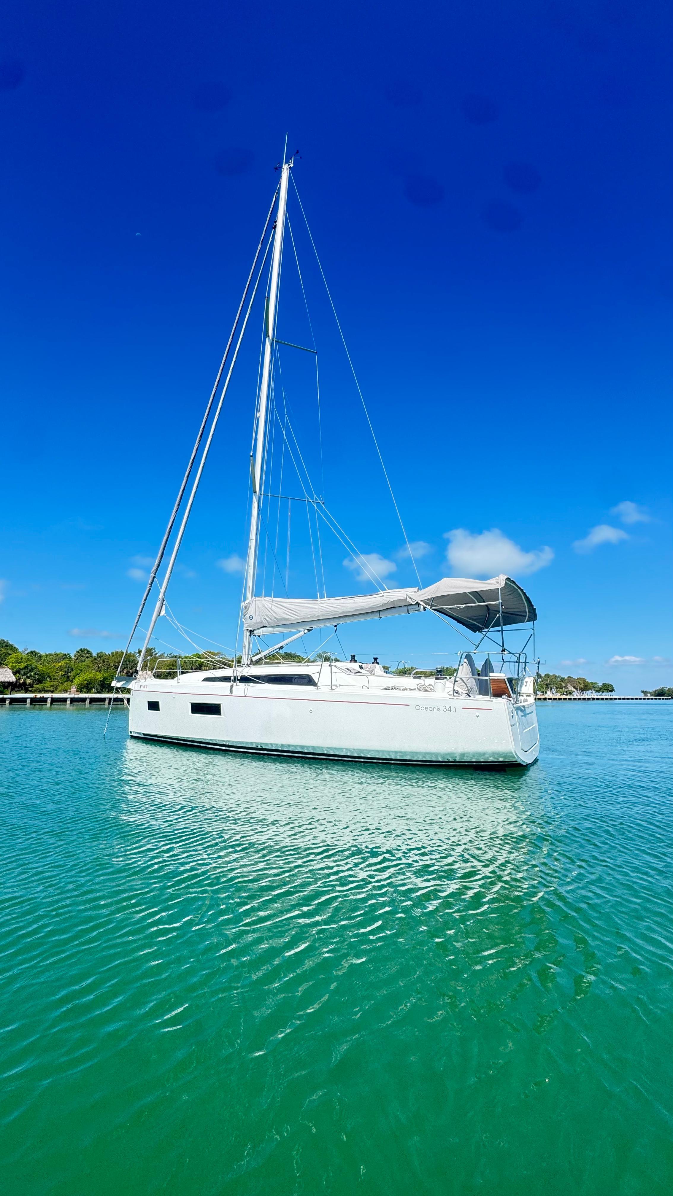 Beneteau Oceanis 34.1 2023 Beneteau Oceanis 34.1 sailboat on clear blue water under a bright sky.