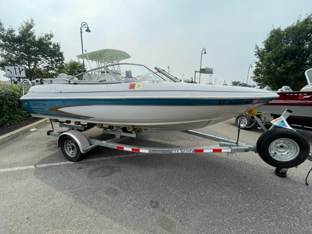 Glastron SSV 170 1996 Glastron SSV 170 boat on trailer in parking lot.