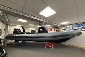 Brig Eagle 6.7 2025 Brig Eagle 6.7 boat displayed indoors with Suzuki engine.