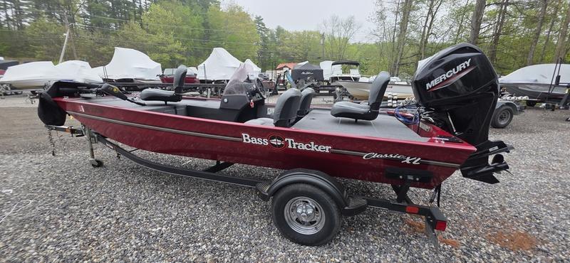 Tracker BT CLASSIC XL 2020 Tracker BT Classic XL boat with Mercury engine, parked on gravel lot.