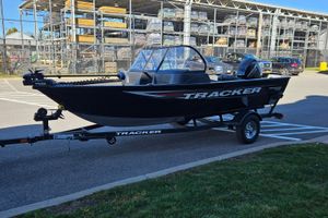 Tracker Pro Guide V-16 WT 2026 Tracker Pro Guide V-16 WT boat on trailer in parking lot.
