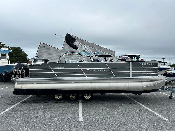 Berkshire 24RFC LE 2.75 2024 Berkshire 24RFC LE 2.75 pontoon boat in a parking lot.