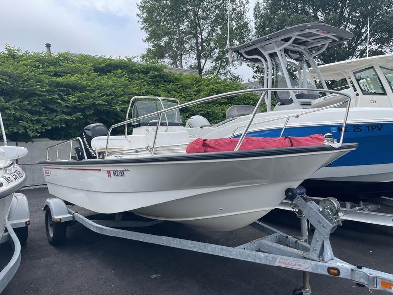 Boston Whaler 170 Montauk 2008 Boston Whaler 170 Montauk boat on trailer, parked outdoors.