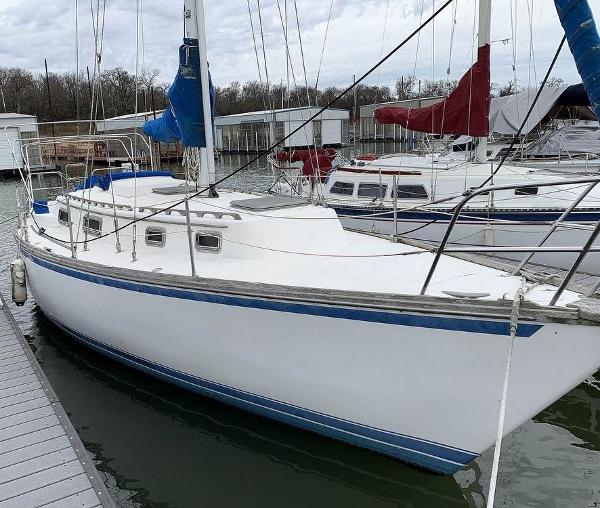 Mariner 36 1980 Mariner 36 sailboat docked at marina with other boats.
