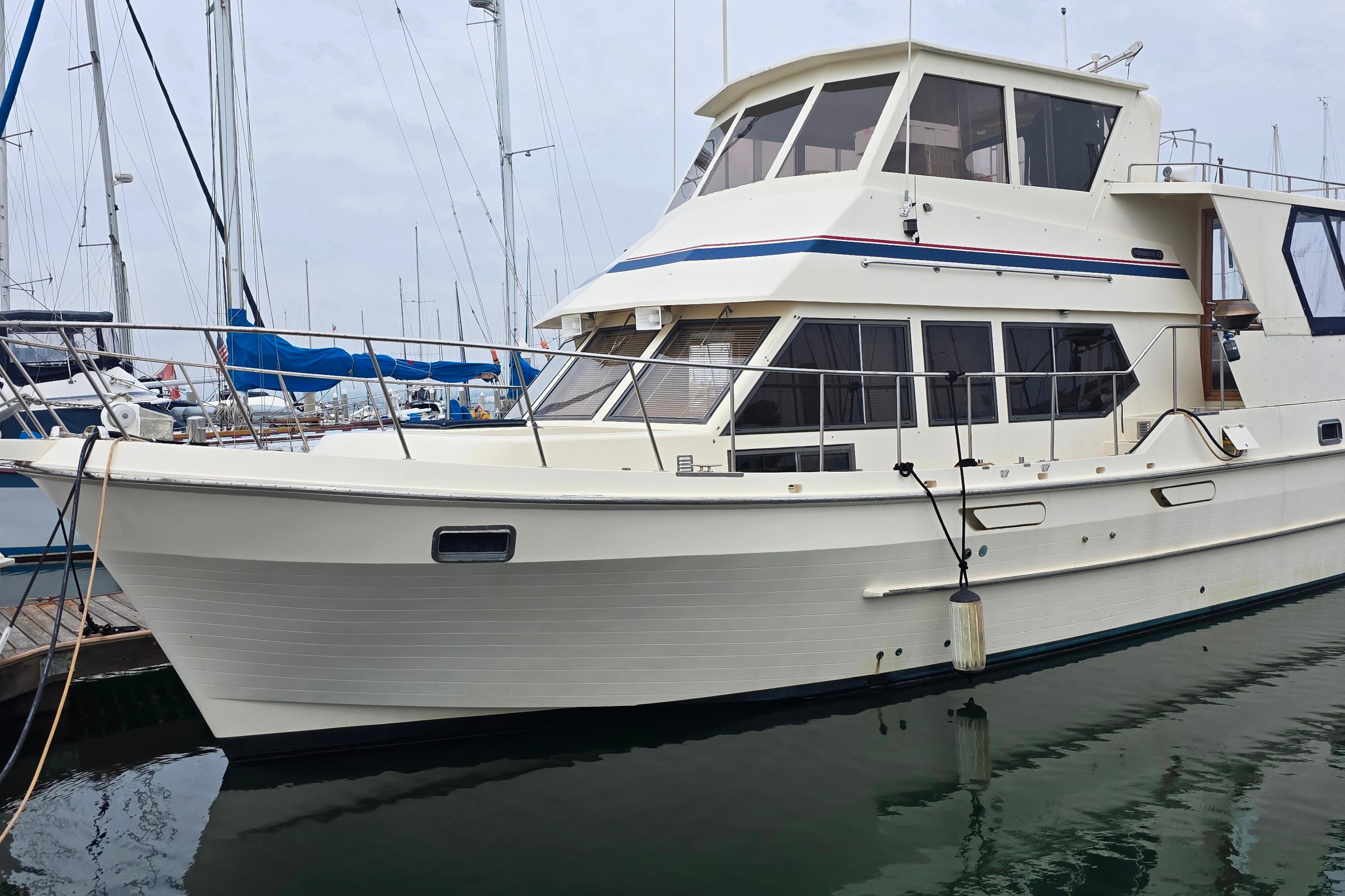 CHB Ponderosa 42 1986 CHB Ponderosa 42 yacht docked at marina, showcasing classic design and spacious cabin.