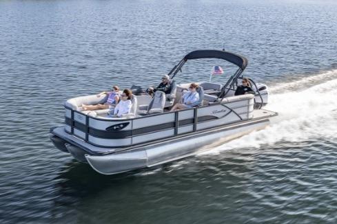 Bentley Pontoons Legacy 243 Navigator 2026 Bentley Pontoons Legacy 243 Navigator cruising on a lake with passengers enjoying the ride.