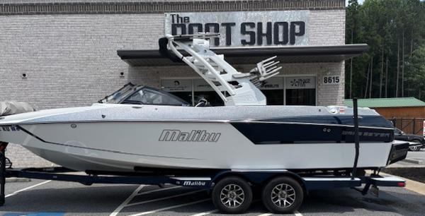 Malibu Wakesetter 24 MXZ 2019 Malibu Wakesetter 24 MXZ boat on trailer outside The Boat Shop.