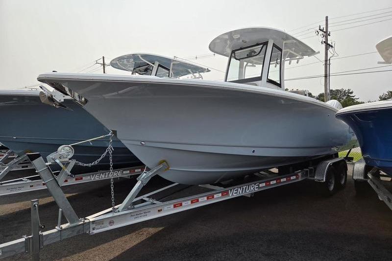 Sea Hunt Ultra 275 SE 2025 Sea Hunt Ultra 275 SE boat on trailer, side view.