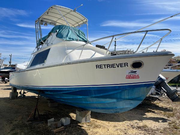 Bertram 31 Sportfisher 1971 Bertram 31 Sportfish boat "Retriever" for sale, displayed on blocks.