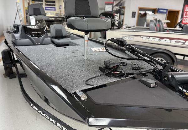Tracker Pro 170 2025 Tracker Pro 170 boat with seating and equipment, displayed indoors.