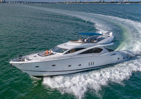 Sunseeker 82 Yacht 2003 Sunseeker 82 Yacht cruising on open water, showcasing sleek design and luxury.