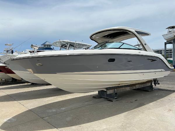 Sea Ray 310 SLX 2019 Sea Ray 310 SLX boat on display at a marina.