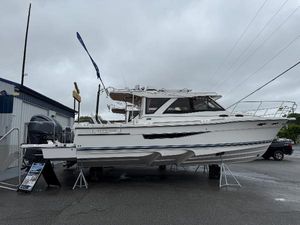 Cutwater C-32 Coupe 2025 Cutwater C-32 C boat displayed outdoors on a cloudy day.