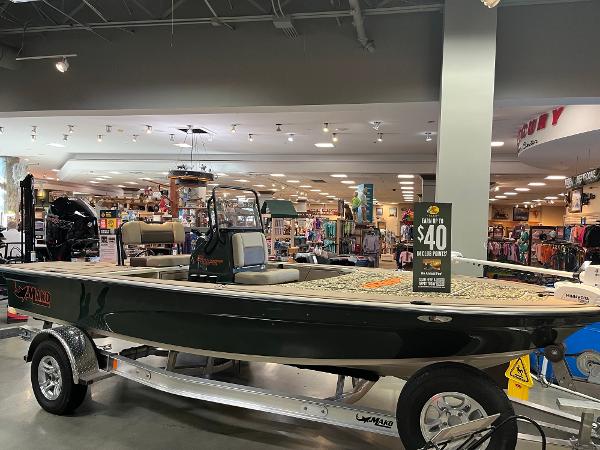 Mako 18 Pro Skiff Backwater Edition 2025 Mako 18 Pro Skiff Backwater Edition displayed in a showroom on a trailer.