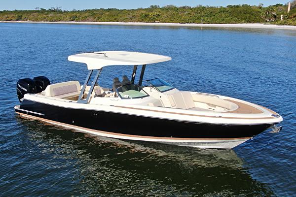 Chris-Craft 30 Calypso 2018 Chris-Craft 30 Calypso boat on calm water with scenic shoreline.