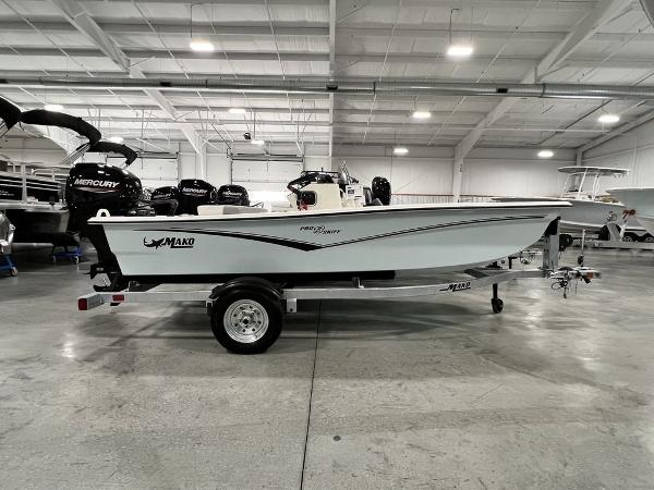 Mako Pro Skiff 13 CC 2023 Mako Pro Skiff 13 CC boat on trailer in showroom.