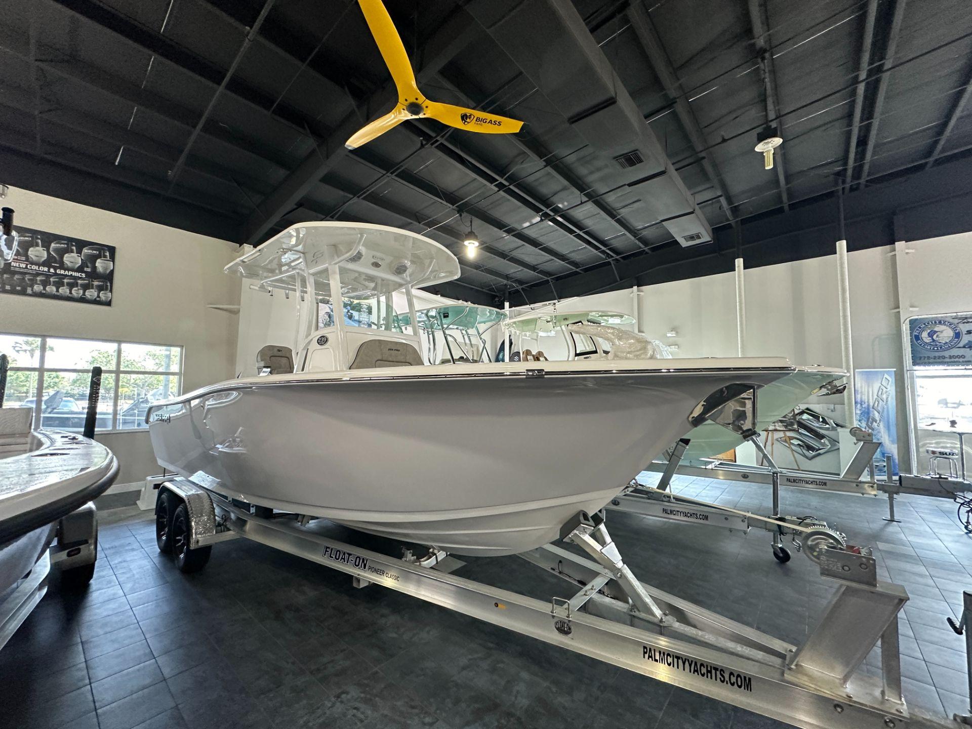 Sea Pro 239 Sport 2024 Sea Pro 239 Sport boat on display in showroom.
