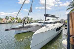McConaghy MC60 2019 McConaghy MC60 catamaran docked in a scenic waterfront setting.