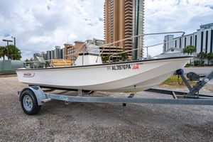 Boston Whaler 17 Montauk 1982 Boston Whaler 17 Montauk boat on trailer, urban background, overcast sky.