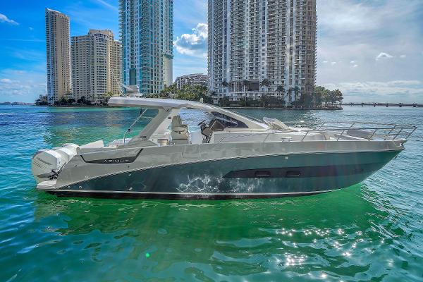 Azimut Verve 40 2020 Azimut Verve 40 yacht cruising near city skyline on clear water.