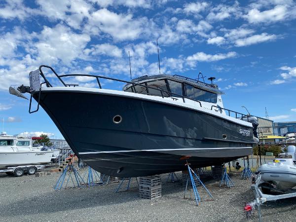 Sargo 36 Explorer 2019 Sargo 36 Explorer boat on stands, under a partly cloudy sky.