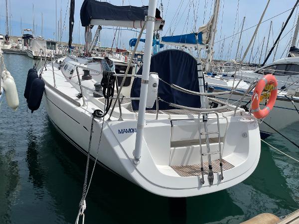 Dufour Dufour 40 2004 Dufour 40 sailboat docked in marina, featuring sleek design and nautical equipment.