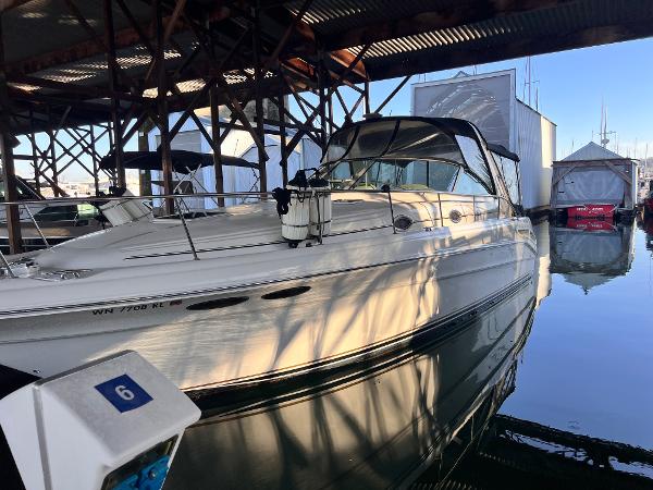 Sea Ray 340 Sundancer 2003 Sea Ray 340 Sundancer docked in a marina under a covered structure.
