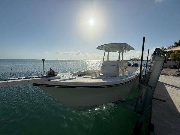 Parker 2801 Center Console 2022 Parker 2801 Center Console boat docked by the ocean under a bright sun.
