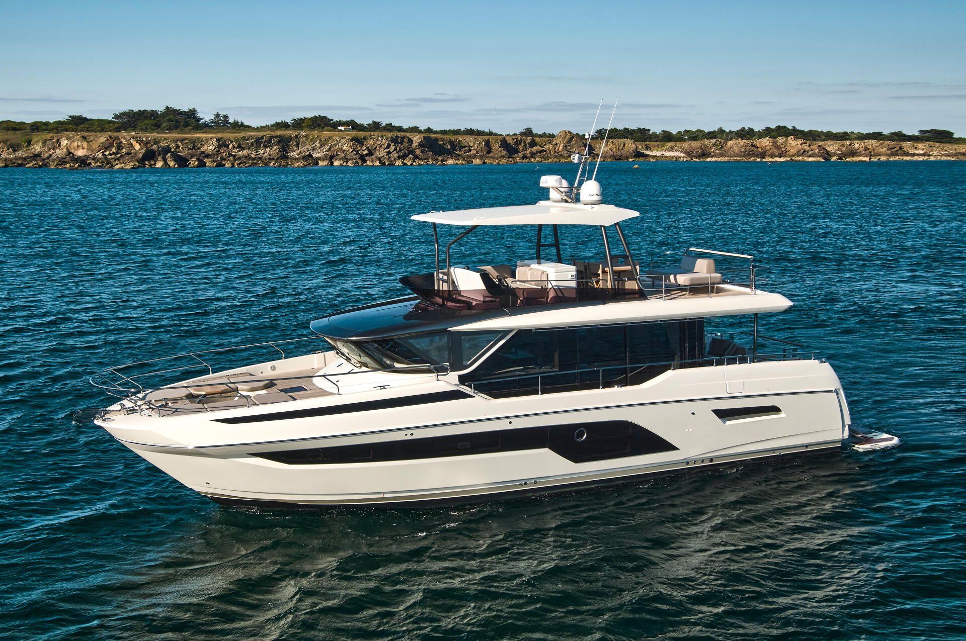 Prestige X60 Luxury Prestige X60 yacht cruising on blue ocean waters, 2026 model.