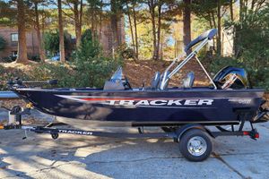 Tracker Pro Guide V-16 SC 2026 Tracker Pro Guide V-16 SC boat on trailer, parked outdoors.