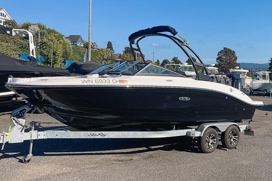 Sea Ray SPX 210 2022 Sea Ray SPX 210 boat on trailer, parked outdoors under clear blue sky.