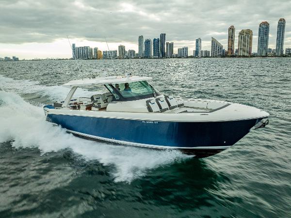 Tiara Sport 43 LS 2021 Tiara Sport 43 LS cruising on water with city skyline in background.