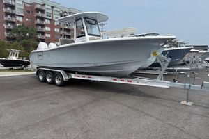 Sea Hunt Ultra 265 SE 2026 Sea Hunt Ultra 265 SE boat on trailer, parked in urban setting.