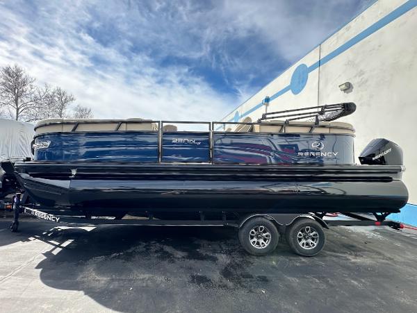 Regency 230 DL3 2025 Regency 230 DL3 pontoon boat with sleek design on a trailer.