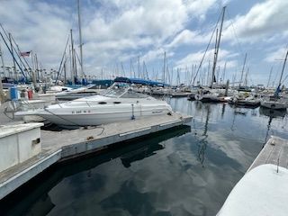 Wellcraft 2400 Martinique 2001 Wellcraft 2400 Martinique boat docked in a marina with sailboats.