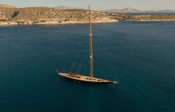 Camper & Nicholsons J Class Aerial view of 1929 Camper & Nicholsons J Class yacht on serene blue waters.