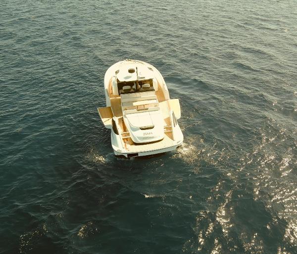 Solaris Power 48 2021 Solaris Power 48 yacht cruising on open water, aerial view.