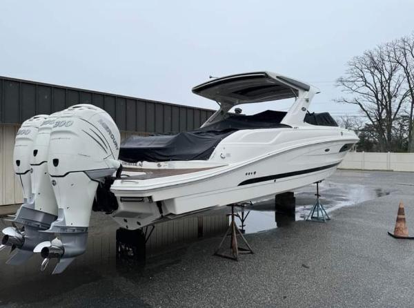 Sea Ray SLX 350 Outboard 2018 Sea Ray SLX 350 OB boat with twin outboard engines on stands.
