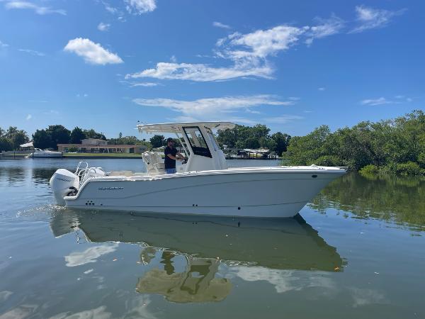 World Cat 260 CC-X 2024 World Cat 260 CC-X boat on calm water under blue sky.