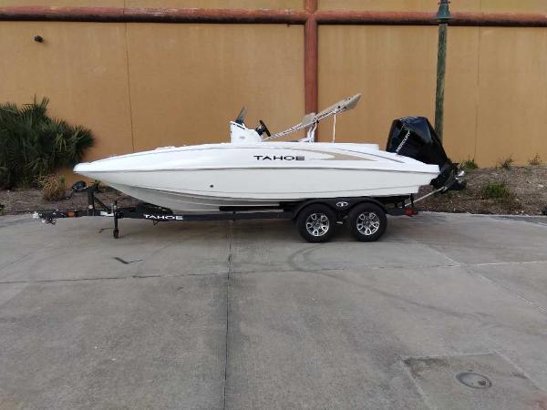 Tahoe 2150 CC 2025 Tahoe 2150 CC boat on trailer, parked outdoors.