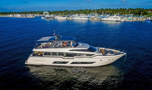 Ferretti Yachts 850 Motoryacht 2018 Ferretti Yachts 850 Motoryacht cruising on a sunny day near a marina.