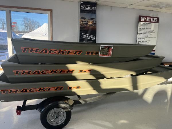 Tracker Grizzly 1236 Utility 2025 Tracker Grizzly 1236 Utility boats stacked in showroom, showcasing durable design.