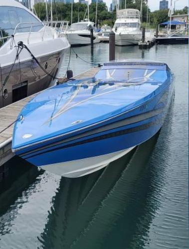 Cigarette 46' Rider XP Blue 2009 Cigarette 46' Rider XP speedboat docked in marina with other yachts.