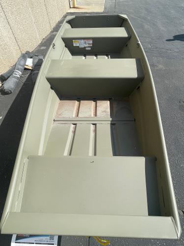 Tracker Grizzly 1436 Utility 2025 Tracker Grizzly 1436 Utility boat, olive green, parked on pavement.